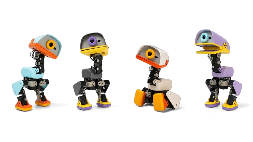 Four versions of the colourful open-source Microduck biped robot